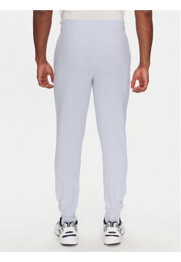 Puma Spodnie dresowe Ess 684714 Fioletowy Regular Fit. Kolor: fioletowy. Materiał: bawełna