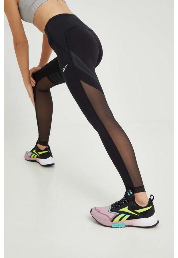 Reebok legginsy treningowe Lux Perform damskie kolor czarny gładkie. Kolor: czarny. Materiał: lycra, skóra, materiał. Wzór: gładki. Sport: fitness