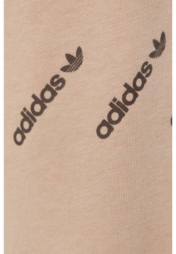adidas Originals spodnie damskie kolor beżowy z nadrukiem. Stan: podwyższony. Kolor: beżowy. Materiał: materiał, włókno, dzianina. Wzór: nadruk