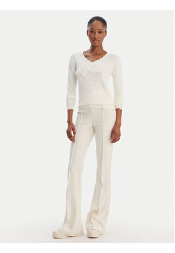 Guess Spodnie materiałowe W4YB01 KCBO2 Beżowy Flare Fit. Kolor: beżowy. Materiał: syntetyk