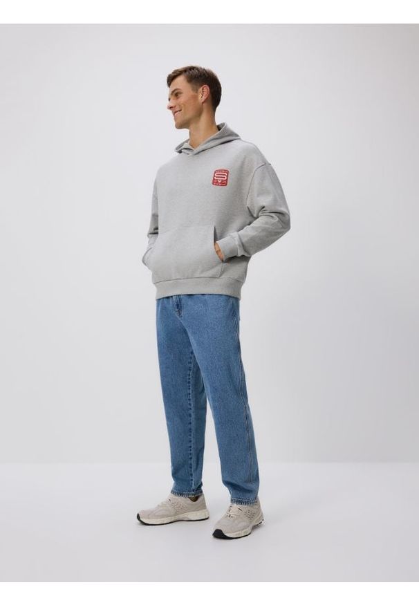 Reserved - Bluza z kapturem SUPERMAN™ - jasnoszary. Typ kołnierza: kaptur. Kolor: szary. Materiał: dzianina, bawełna. Wzór: motyw z bajki