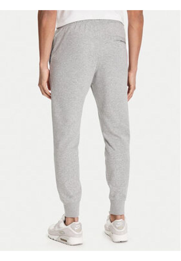 Nike Spodnie dresowe Club Fleece FN3801 Szary Regular Fit. Kolor: szary. Materiał: bawełna