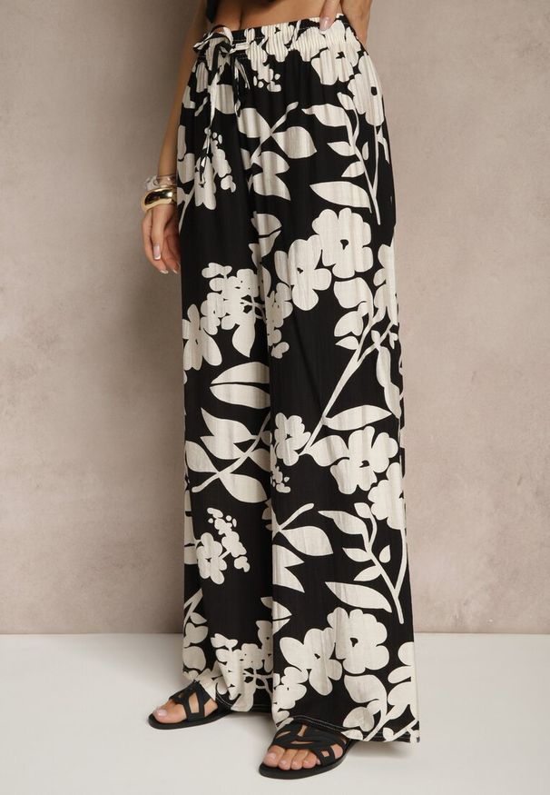 Renee - Czarne Szerokie Spodnie z Wiskozy High Waist w Kwiatowy Wzór Elaneora. Okazja: na co dzień. Stan: podwyższony. Kolor: czarny. Materiał: wiskoza. Wzór: kwiaty. Styl: casual, elegancki