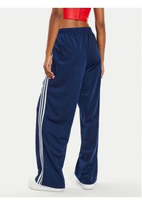 Adidas - adidas Spodnie dresowe Firebird IL3817 Granatowy Loose Fit. Kolor: niebieski. Materiał: syntetyk #4