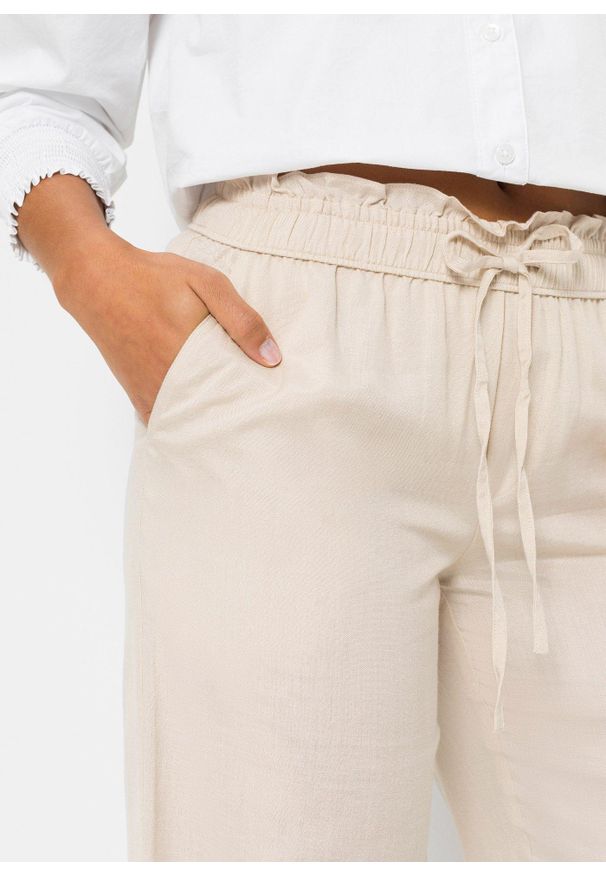 bonprix - Spodnie palazzo z przewiewnej mieszanki lnu. Kolor: beżowy. Materiał: len