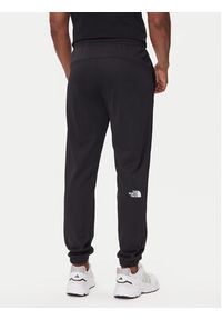 The North Face Spodnie dresowe Reaxion 2.0 NF0A8DRS Czarny Regular Fit. Kolor: czarny. Materiał: syntetyk