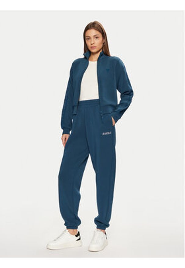 Guess Spodnie dresowe V4BB13 K7UW2 Niebieski Regular Fit. Kolor: niebieski. Materiał: wiskoza