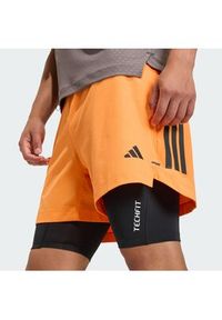 Adidas - adidas Szorty sportowe D4T PrimeLift 3 Stripes KA1197 Pomarańczowy Regular Fit. Kolor: pomarańczowy. Materiał: syntetyk #2