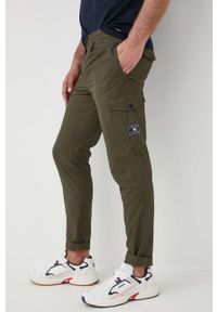 TOMMY HILFIGER - Tommy Hilfiger spodnie bawełniane męskie kolor zielony w fasonie chinos. Kolor: zielony. Materiał: bawełna