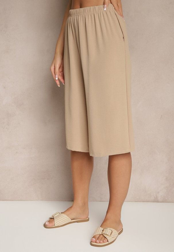 Renee - Beżowe Luźne Spodnie 3/4 z Kieszonkami Efrinea. Okazja: na co dzień. Kolor: beżowy. Materiał: guma. Styl: elegancki, casual