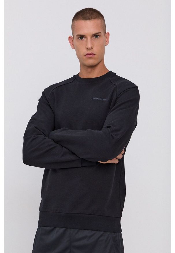 Peak Performance Bluza bawełniana męska kolor czarny gładka. Okazja: na co dzień. Kolor: czarny. Materiał: bawełna. Długość rękawa: raglanowy rękaw. Wzór: gładki, aplikacja. Styl: casual