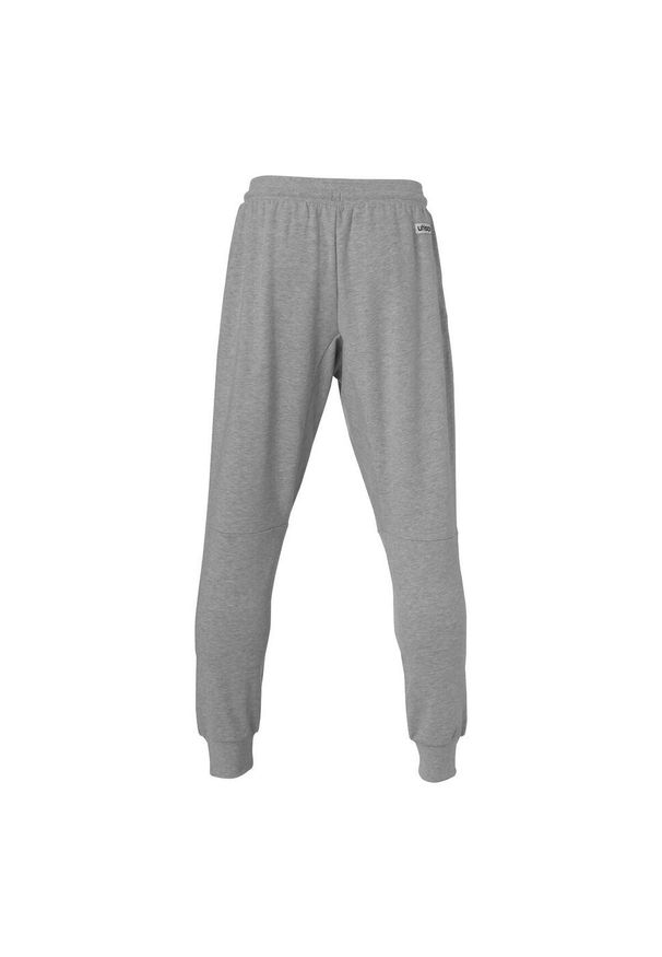 UHLSPORT - Nowe spodnie dresowe dla dzieci Uhlsport Essential. Kolor: czarny, biały, szary, wielokolorowy. Materiał: dresówka. Sport: piłka nożna