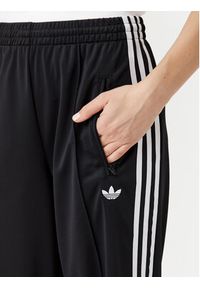 Adidas - adidas Spodnie dresowe adicolor Classic Firebird JC8245 Czarny Loose Fit. Kolor: czarny. Materiał: syntetyk #2