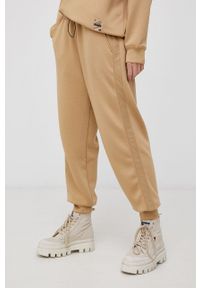 Diadora Spodnie damskie kolor beżowy gładkie. Kolor: beżowy. Materiał: tkanina, dzianina. Wzór: gładki