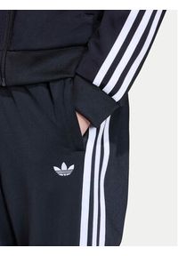 Adidas - adidas Spodnie dresowe adicolor SST KE2862 Czarny Regular Fit. Kolor: czarny. Materiał: syntetyk #6