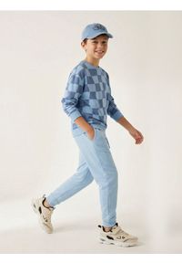 Sinsay - Spodnie dresowe loose - błękitny. Kolor: niebieski. Materiał: dresówka #1