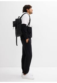 bonprix - Spodnie dresowe z prążkowanym ściągaczem w talii. Kolor: czarny. Materiał: prążkowany, dresówka. Styl: sportowy #3