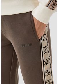 Guess - GUESS Brązowe damskie spodnie dresowe Britney Jogger, Rozmiar XS. Kolor: brązowy. Materiał: dresówka. Długość: długie #5