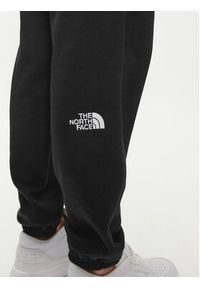 The North Face Spodnie dresowe Essential NF0A7ZJF Czarny Relaxed Fit. Kolor: czarny. Materiał: syntetyk, bawełna