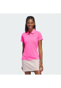 Adidas - Damska koszulka polo z krótkim rękawem Solid Performance. Typ kołnierza: polo. Kolor: różowy. Długość rękawa: krótki rękaw. Długość: krótkie. Styl: klasyczny, sportowy #1