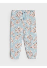 Sinsay - Spodnie dresowe jogger ze wzorem w kwiaty - niebieski. Kolor: niebieski. Materiał: dresówka. Wzór: kwiaty #1