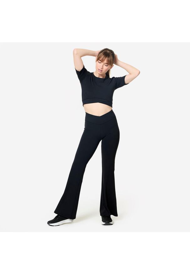 Decathlon - Koszulka damska Domyos Gym & Pilates crop. Kolor: czarny. Materiał: poliamid, materiał, elastan. Sport: joga i pilates