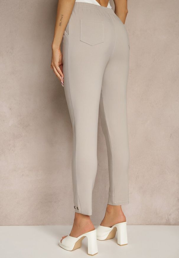 Renee - Beżowe Spodnie z Wiskozą High Waist i Ozdobnymi Napami Redaira. Okazja: na co dzień. Stan: podwyższony. Kolor: beżowy. Materiał: wiskoza. Wzór: aplikacja. Styl: sportowy, elegancki, casual