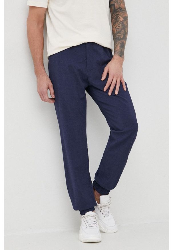 Emporio Armani spodnie wełniane I1P960.I1581 męskie kolor granatowy joggery. Kolor: niebieski. Materiał: wełna