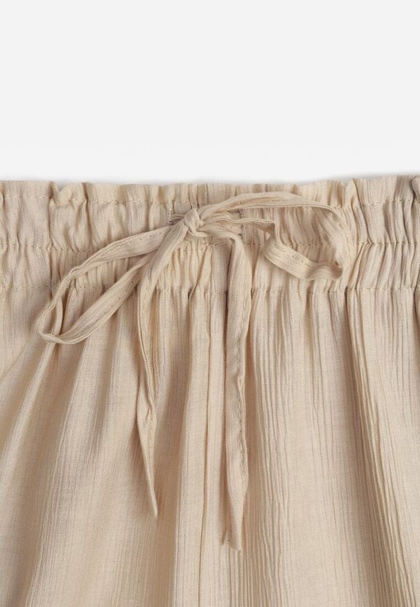 Renee - Beżowe Szerokie Spodnie z Wiskozy i Gumką w Pasie Abyga. Okazja: na co dzień. Kolor: beżowy. Materiał: wiskoza. Styl: casual