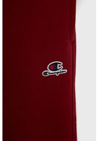 Champion Spodnie dziecięce 404229 kolor bordowy gładkie. Kolor: czerwony. Wzór: gładki #2