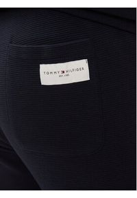 TOMMY HILFIGER - Tommy Hilfiger Spodnie dresowe UM0UM03013 Granatowy Regular Fit. Kolor: niebieski. Materiał: bawełna