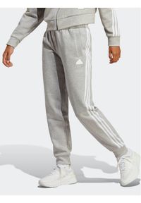 Adidas - adidas Spodnie dresowe Future Icons 3-Stripes IB8531 Szary Regular Fit. Kolor: szary. Materiał: bawełna