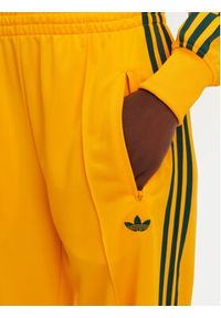 Adidas - adidas Spodnie dresowe adicolor Classic Firebird JP2316 Żółty Loose Fit. Kolor: żółty. Materiał: syntetyk #2