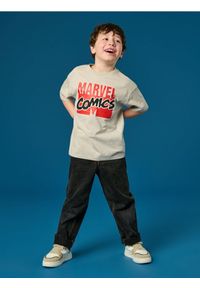 Sinsay - Bawełniana koszulka z nadrukiem na plecach Marvel - kremowy. Kolor: kremowy. Materiał: bawełna. Długość rękawa: krótki rękaw. Długość: krótkie. Wzór: motyw z bajki, nadruk #1