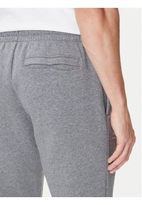 Under Armour Spodnie dresowe UA Essential Fleece Jogger 1373882 Szary Regular Fit. Kolor: szary. Materiał: bawełna