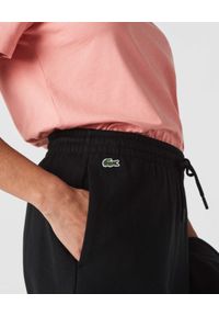Lacoste - LACOSTE - Czarne spodnie dresowe z logo. Kolor: czarny. Materiał: dresówka #5