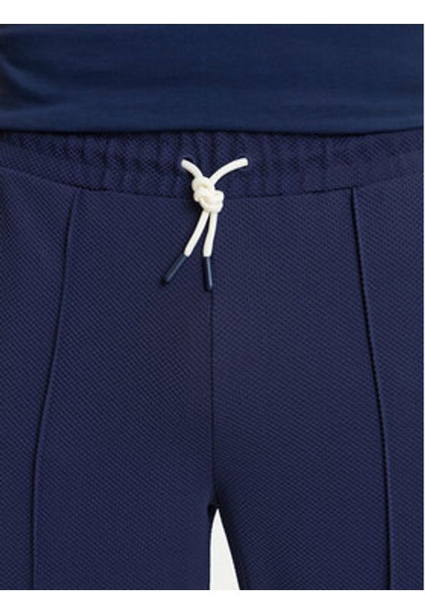 Guess Spodnie dresowe Z6GB14 K3211 Granatowy Regular Fit. Kolor: niebieski. Materiał: syntetyk