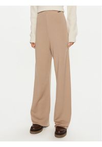 Calvin Klein Spodnie dresowe K20K207680 Beżowy Relaxed Fit. Kolor: beżowy. Materiał: wełna
