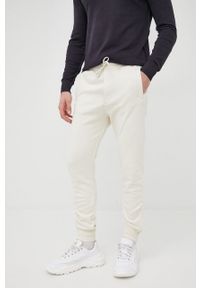 Tom Tailor spodnie męskie kolor beżowy. Kolor: beżowy. Materiał: dzianina, materiał, włókno