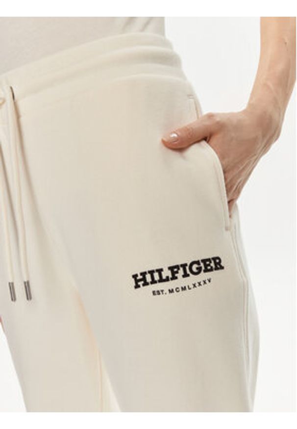 TOMMY HILFIGER - Tommy Hilfiger Spodnie dresowe Monotype WW0WW41572 Beżowy Regular Fit. Kolor: beżowy. Materiał: bawełna