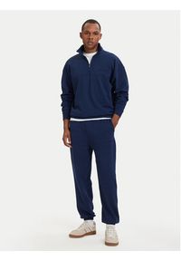 TOMMY HILFIGER - Tommy Hilfiger Spodnie dresowe Essential UM0UM03911 Granatowy Relaxed Fit. Kolor: niebieski. Materiał: bawełna #4
