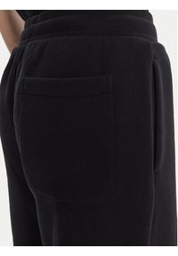 AMI PARIS - AMI Paris Spodnie dresowe UTR240.747 Czarny Regular Fit. Kolor: czarny. Materiał: bawełna #4