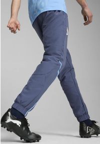 Puma - Męskie spodnie przedmeczowe z tkaniny Manchester City PUMA Inky Blue Team Light. Kolor: niebieski. Materiał: tkanina