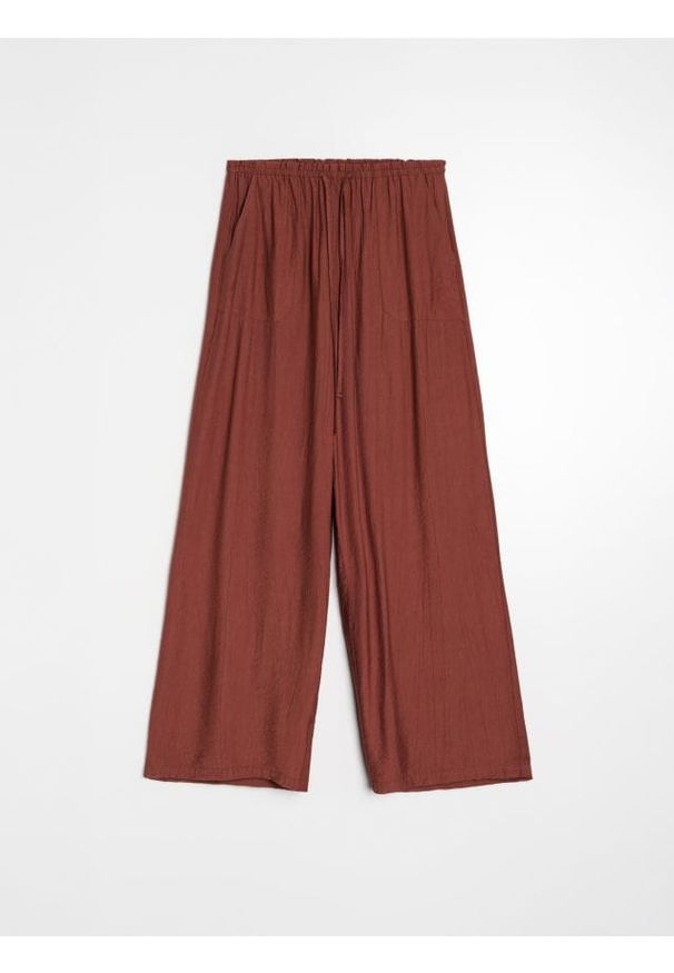 Sinsay - Spodnie wide leg z wiskozą - żółty. Kolor: żółty