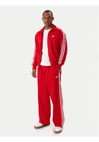Adidas - adidas Spodnie dresowe adicolor KE3498 Czerwony Loose Fit. Kolor: czerwony. Materiał: bawełna #2
