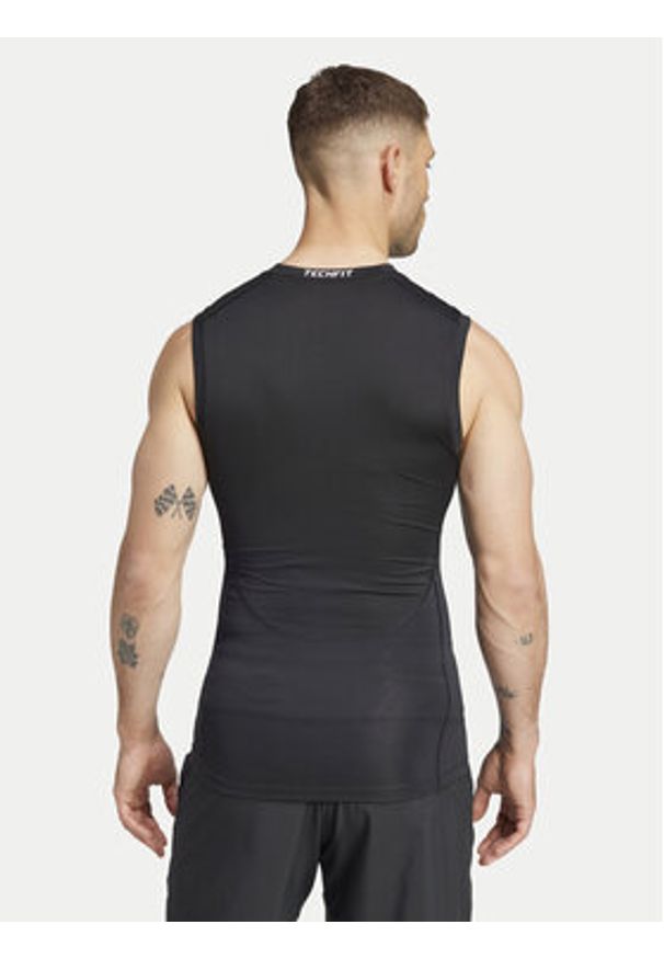 Adidas - adidas Koszulka techniczna TECHFIT Compression Training JE6694 Czarny Slim Fit. Kolor: czarny. Materiał: syntetyk. Technologia: Techfit (Adidas)