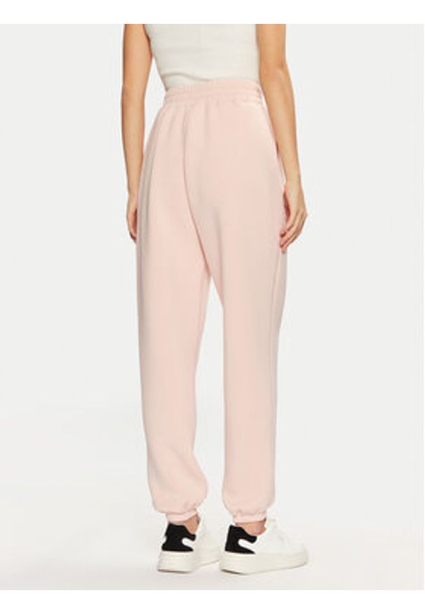 Guess Spodnie dresowe V4BB13 K7UW2 Różowy Regular Fit. Kolor: różowy. Materiał: wiskoza