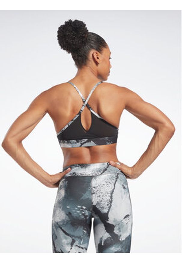 Reebok Biustonosz sportowy Lux Strappy Allover Print HS7793 Czarny. Kolor: czarny. Materiał: syntetyk. Wzór: nadruk