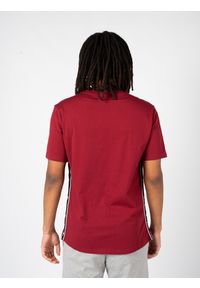 Champion T-Shirt | 217835 | Mężczyzna | Czerwony. Okazja: na co dzień. Kolor: czerwony. Materiał: bawełna. Wzór: nadruk. Styl: casual, sportowy