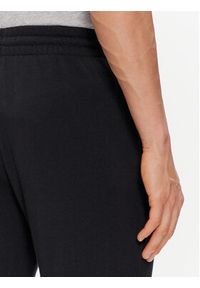 Adidas - adidas Spodnie dresowe Essentials French Terry Tapered Cuff Logo Joggers IC0063 Czarny Regular Fit. Kolor: czarny. Materiał: bawełna #5